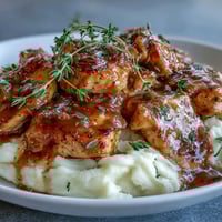 Slow Cooker Honey Mustard Chicken breasts simmering in a velvety, golden sauce, ready to serve over fluffy white rice for a comforting family dinner.